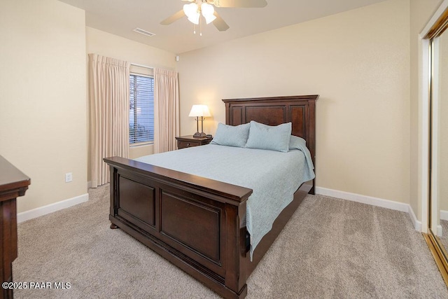 bedroom with ceiling fan and light carpet