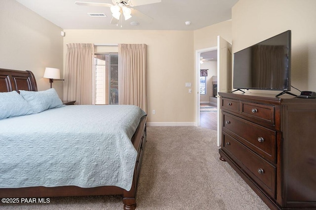 carpeted bedroom with ceiling fan