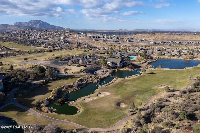 drone / aerial view with a water and mountain view