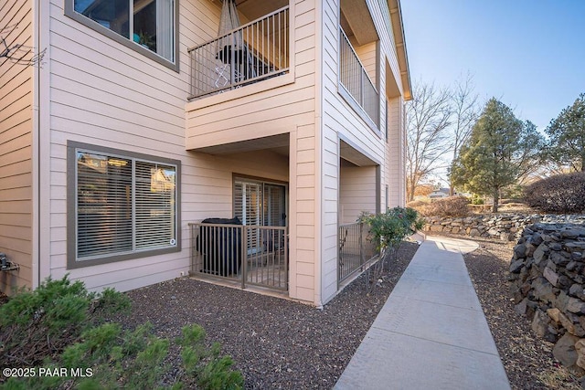 view of home's exterior featuring a balcony