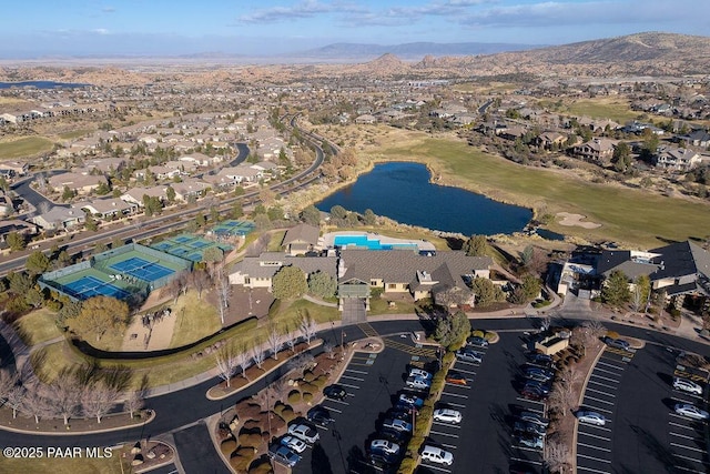 drone / aerial view with a water and mountain view