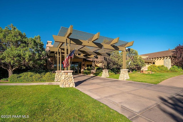 view of front of house featuring a front yard and a pergola