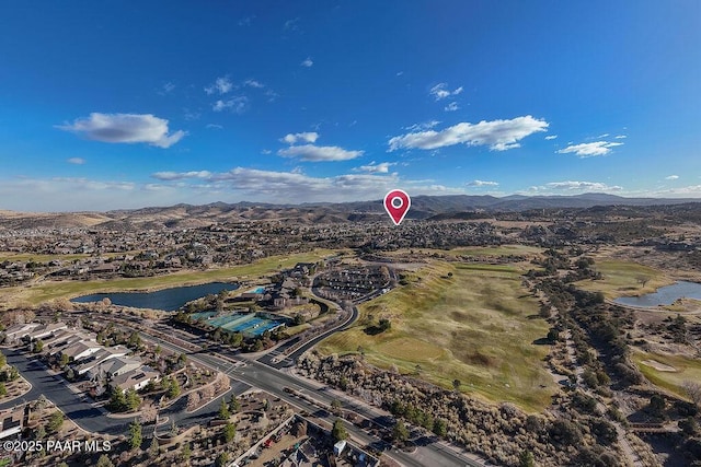 birds eye view of property featuring a water and mountain view