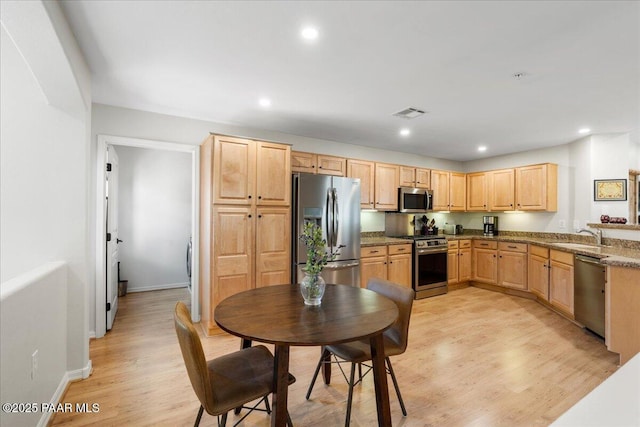 1716 Alpine Meadows Ln Unit 602, Prescott, AZ 86303 - kitchen featuring appliances with stainless steel finishes, light brown cabinets, light wood finished floors, and recessed lighting