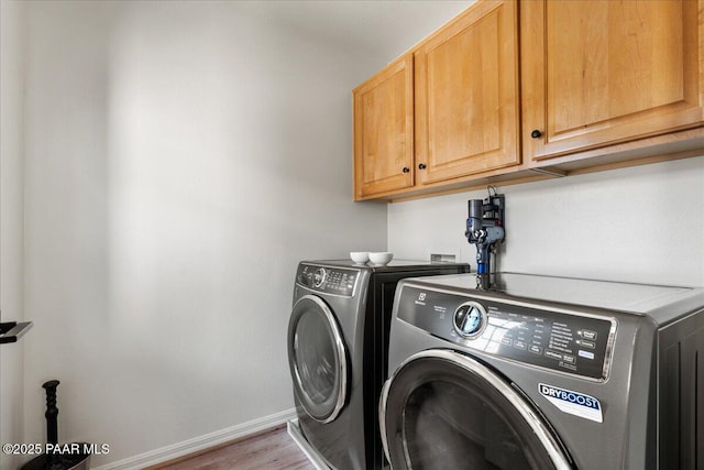 1716 Alpine Meadows Ln Unit 602, Prescott, AZ 86303 - laundry area featuring cabinet space, washing machine and clothes dryer, and wood finished floors