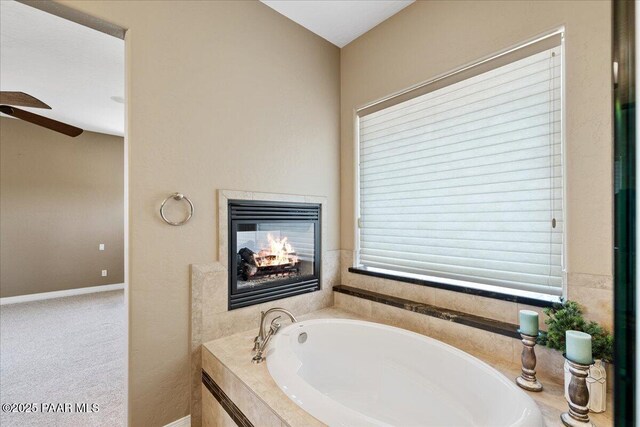 1183 Northridge Dr, Prescott, AZ 86301 - full bath featuring a bath, a ceiling fan, and a multi sided fireplace