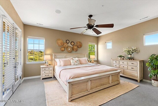 1183 Northridge Dr, Prescott, AZ 86301 - bedroom featuring light colored carpet, multiple windows, and ceiling fan
