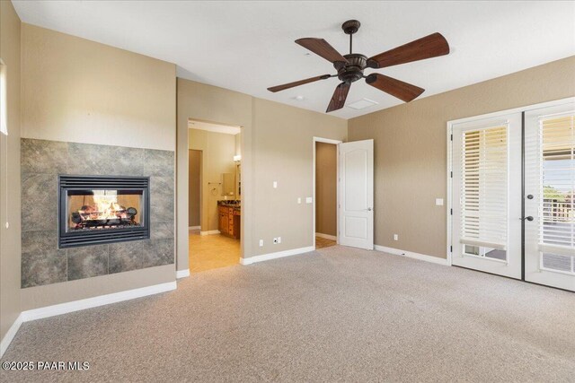 1183 Northridge Dr, Prescott, AZ 86301 - unfurnished bedroom with carpet flooring, a multi sided fireplace, access to outside, ensuite bath, and a ceiling fan