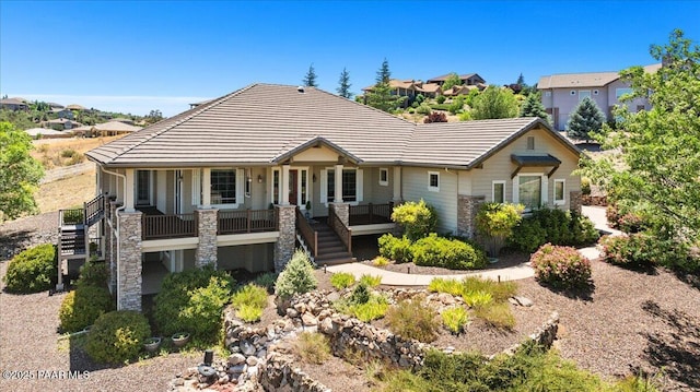 1183 Northridge Dr, Prescott, AZ 86301 - view of front facade with stairs, a tile roof, and covered porch