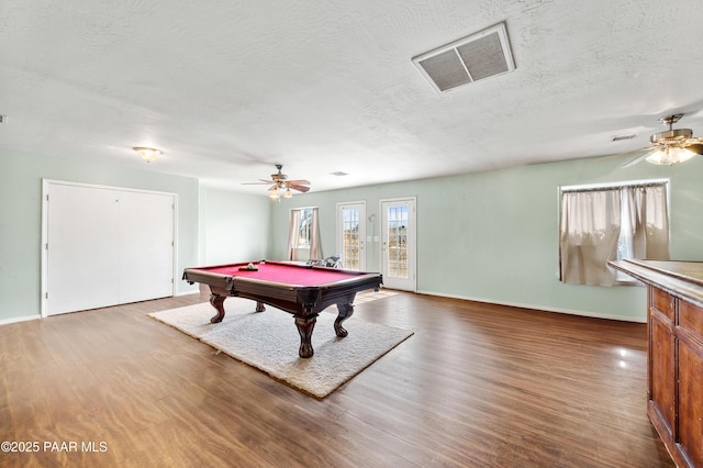 recreation room with ceiling fan, wood-type flooring, billiards, and a textured ceiling