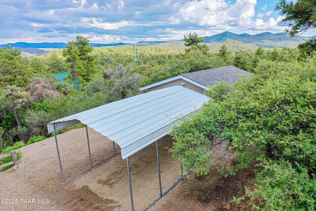 1251 Navajo Way, Prescott, AZ 86305 - aerial view of property and surrounding area featuring a mountain backdrop and a forest