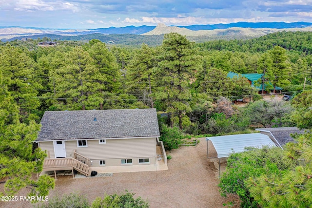 1251 Navajo Way, Prescott, AZ 86305 - aerial view of property and surrounding area featuring a forest and a mountainous background
