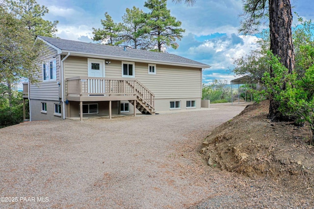 1251 Navajo Way, Prescott, AZ 86305 - back of house with stairs, a wooden deck, and a chimney