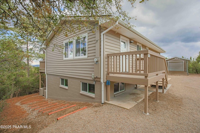 1251 Navajo Way, Prescott, AZ 86305 - view of property exterior with an outbuilding, a deck, and a detached garage