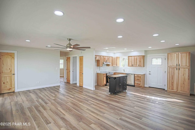 1251 Navajo Way, Prescott, AZ 86305 - kitchen with stainless steel appliances, recessed lighting, light countertops, open floor plan, and baseboards
