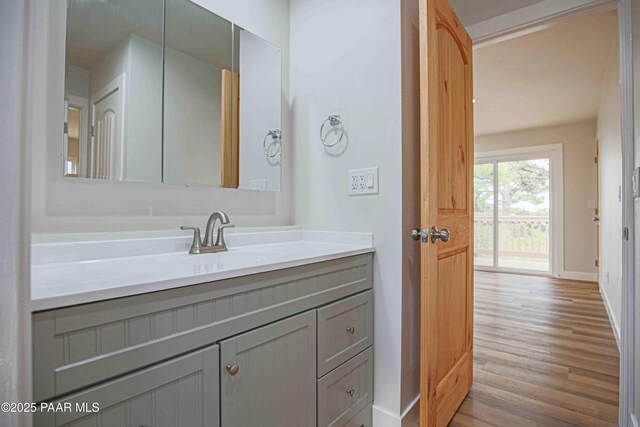 1251 Navajo Way, Prescott, AZ 86305 - bathroom featuring vanity, wood finished floors, and baseboards