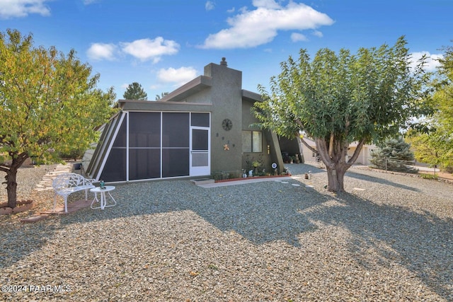 view of front of home with a sunroom