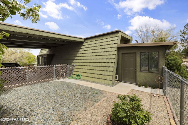 exterior space featuring a carport