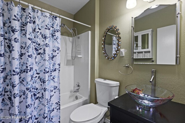 full bathroom with vanity, toilet, and shower / tub combo with curtain