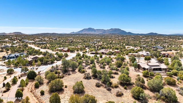 drone / aerial view featuring a residential view and a mountain view