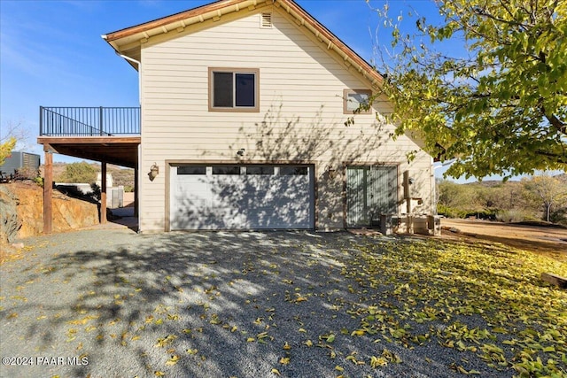14420 Jagged Tooth Trl, Mayer, AZ 86333 - view of front of home featuring a garage, asphalt driveway, and a deck