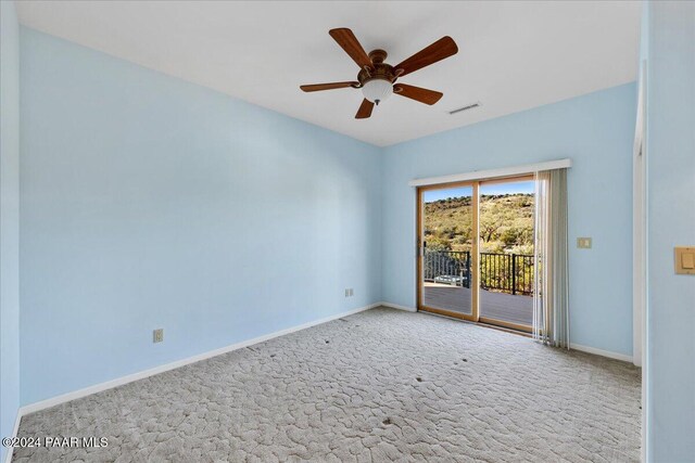 14420 Jagged Tooth Trl, Mayer, AZ 86333 - spare room featuring carpet flooring and ceiling fan