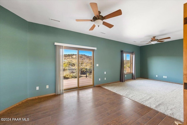 14420 Jagged Tooth Trl, Mayer, AZ 86333 - unfurnished room with plenty of natural light, ceiling fan, and dark hardwood / wood-style flooring