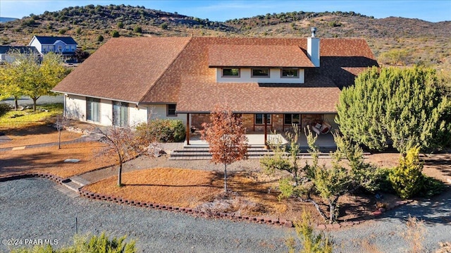 view of front of house with a mountain view and a porch