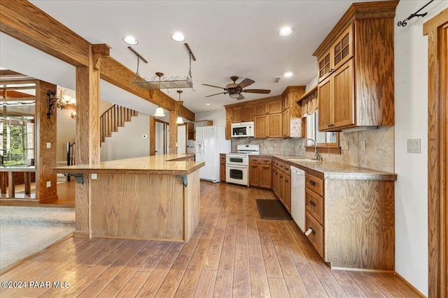 14420 Jagged Tooth Trl, Mayer, AZ 86333 - kitchen with light wood-type flooring, white appliances, plenty of natural light, and sink