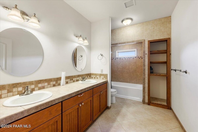 14420 Jagged Tooth Trl, Mayer, AZ 86333 - full bathroom with backsplash, tile patterned floors, vanity, toilet, and tiled shower / bath