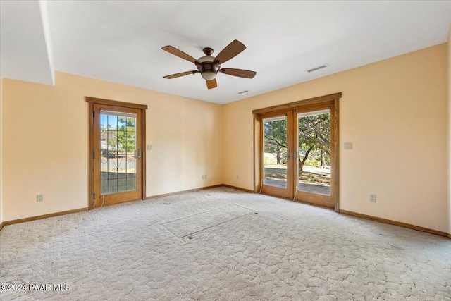 14420 Jagged Tooth Trl, Mayer, AZ 86333 - empty room with a wealth of natural light, ceiling fan, and light colored carpet