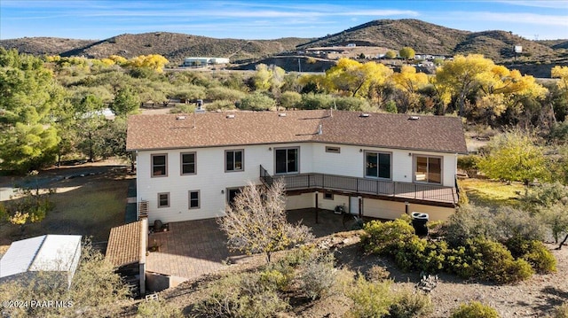 14420 Jagged Tooth Trl, Mayer, AZ 86333 - back of property featuring a mountain view and a patio area