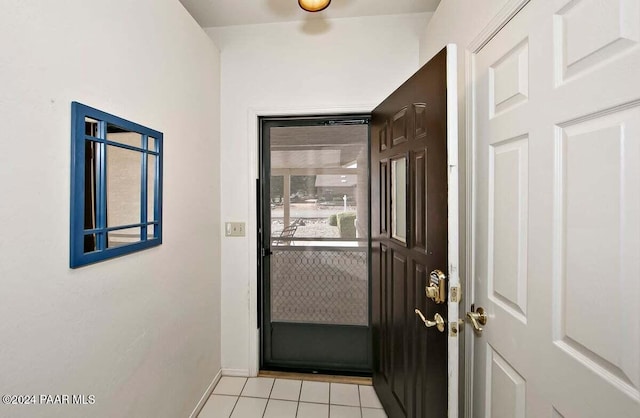 doorway featuring light tile patterned flooring