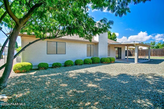 back of house featuring a patio area and ceiling fan