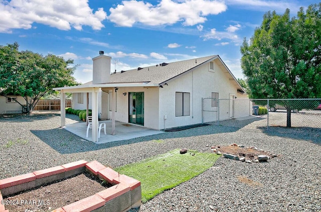 rear view of house featuring a patio