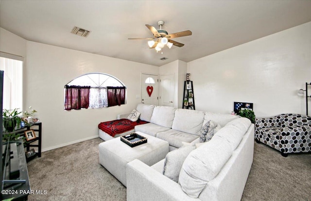 living room featuring carpet floors and ceiling fan