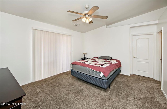 carpeted bedroom featuring ceiling fan and vaulted ceiling