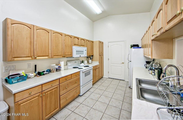 kitchen featuring light tile patterned flooring, high vaulted ceiling, sink, and white appliances