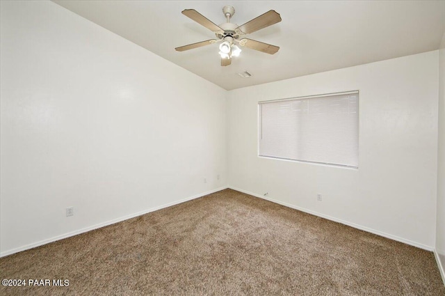 spare room featuring carpet floors and ceiling fan