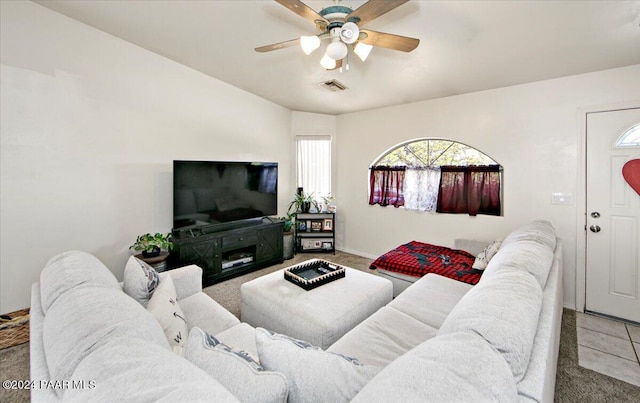 living room featuring tile patterned flooring and ceiling fan