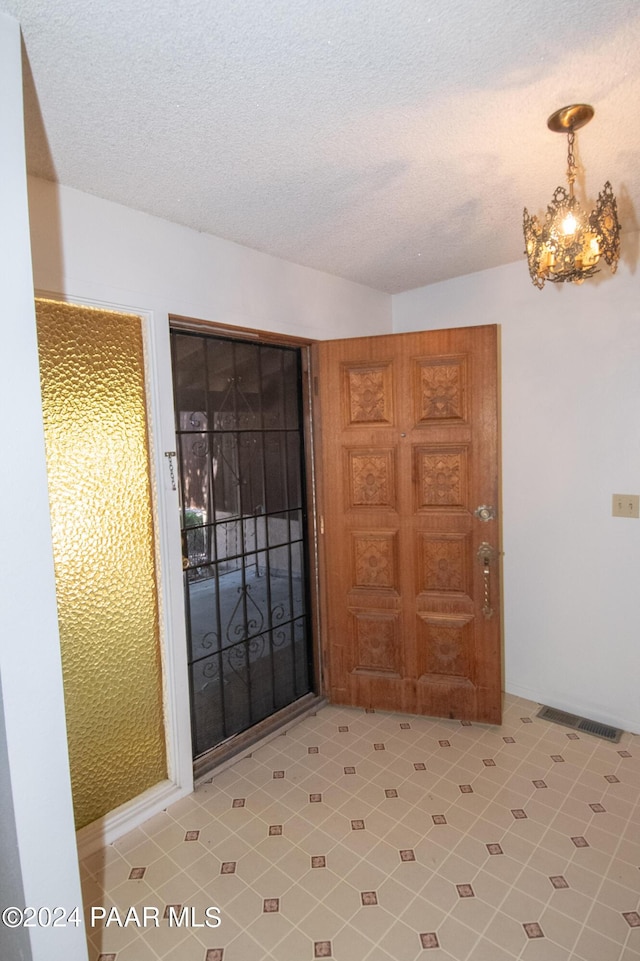 entrance foyer with a textured ceiling