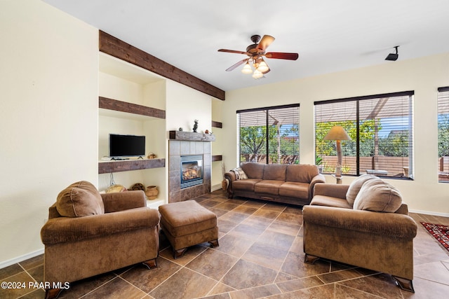 7590 E Traders Trl, Prescott Valley, AZ 86314 - living room with a fireplace, beam ceiling, and ceiling fan