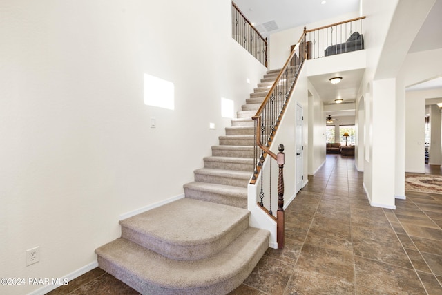 7590 E Traders Trl, Prescott Valley, AZ 86314 - stairway with a towering ceiling