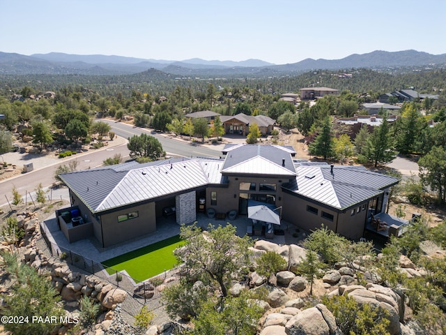 birds eye view of property with a mountain view