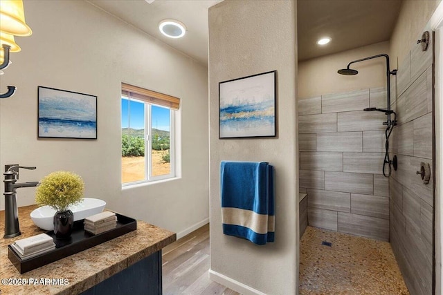 17940 E Native Dancer Ln, Dewey-Humboldt, AZ 86327 - bathroom with walk in shower, wood finished floors, vanity, and recessed lighting