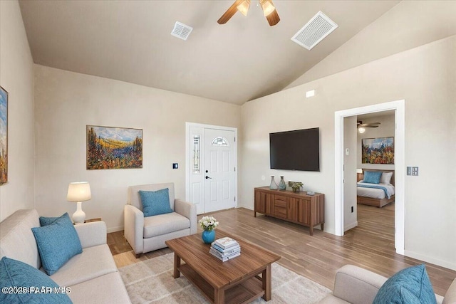 17940 E Native Dancer Ln, Dewey-Humboldt, AZ 86327 - living area featuring a ceiling fan, light wood-style flooring, and high vaulted ceiling