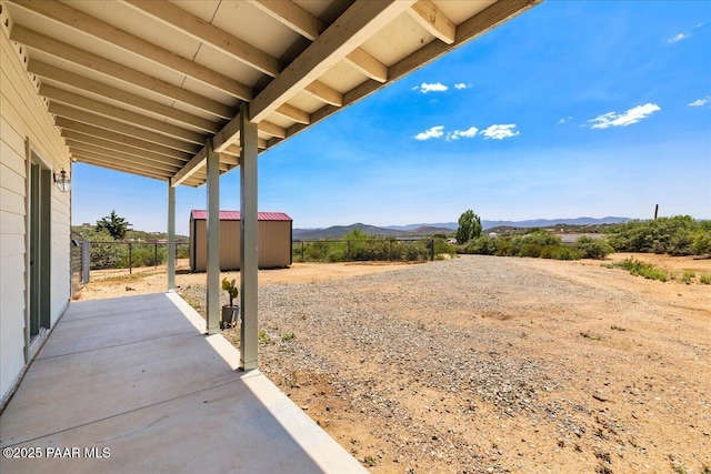 17940 E Native Dancer Ln, Dewey-Humboldt, AZ 86327 - view of yard with a mountain view, a shed, and a patio
