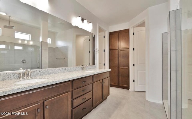 bathroom featuring vanity and a shower with door