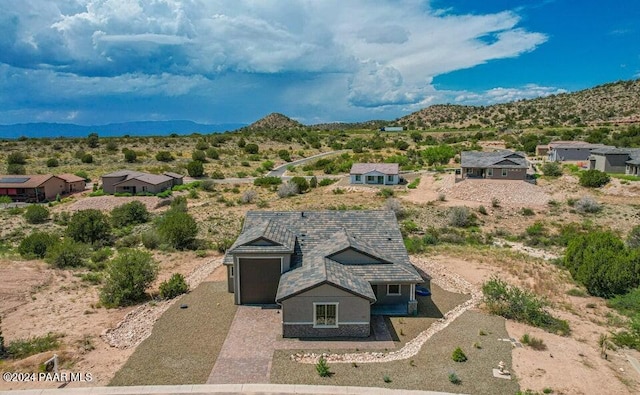 drone / aerial view featuring a mountain view