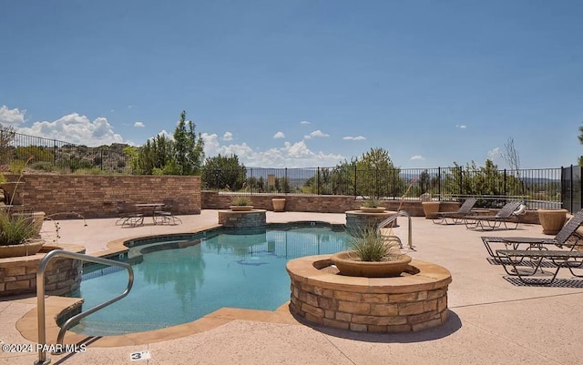 view of pool with a patio